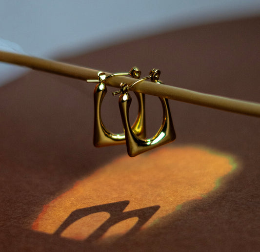 Golden grid loop earrings